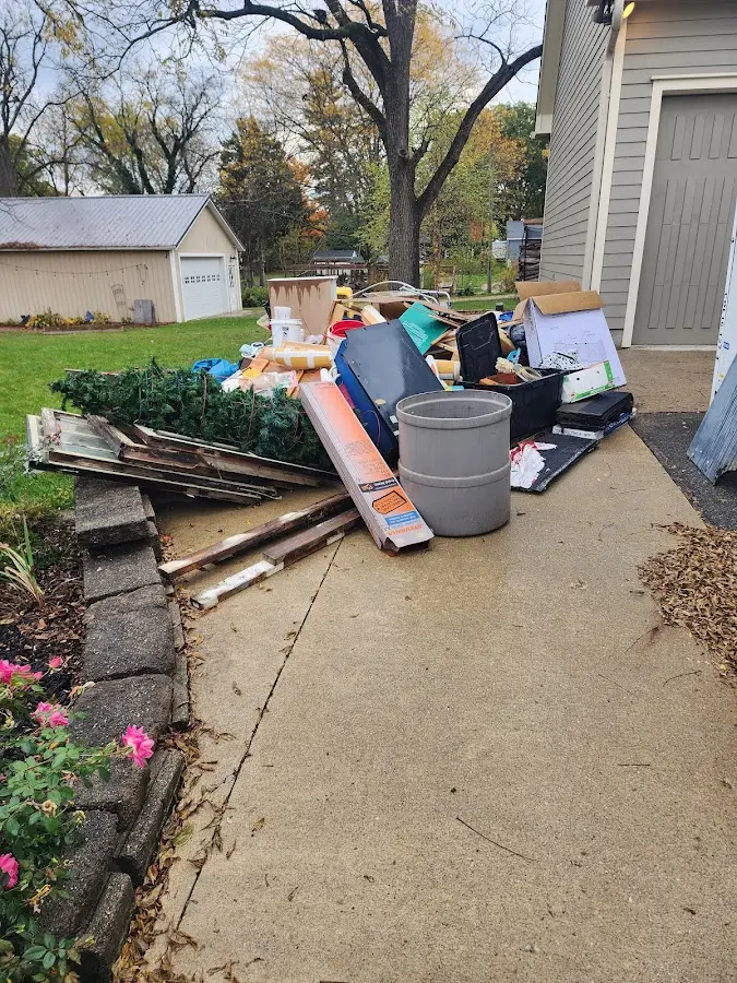 Dumpster being loaded with debris for 30 Yard Dumpster Rental in Wildwood Lake